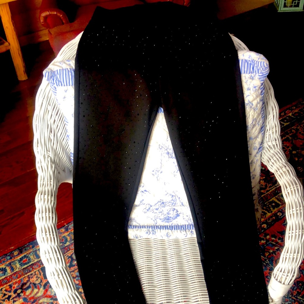 These are beautiful black stretchy pants, size medium. Hand wash.